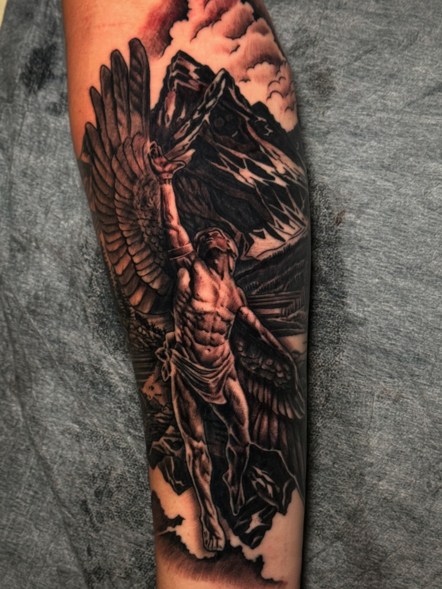 Black and grey realism angel forearm tattoo